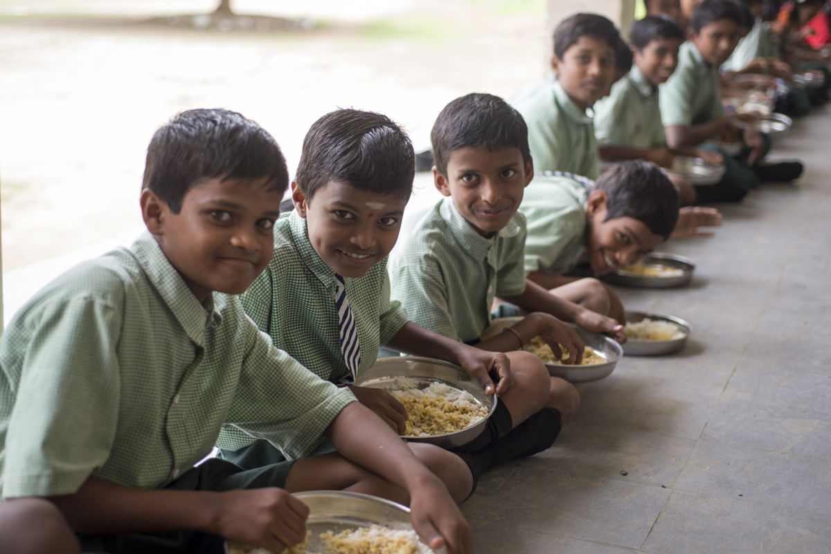 File photo of schoolchildren enjoying mid-day meal served at school.