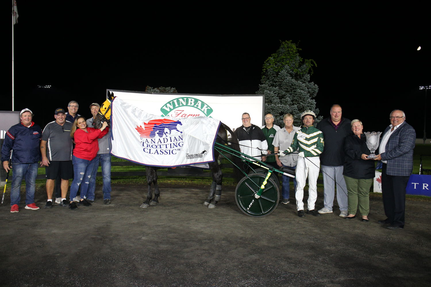 Connections of Celebrity Bambino in the winner's circle for the  Canadian Trotting Classic Final with Celebrity Bambino on September 23, 2023 at Woodbine Mohawk Park (New Image Media)