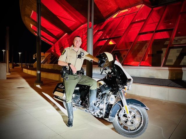 Trooper Thompsen with his motorcycle Trooper Thompsen with his motorcycle