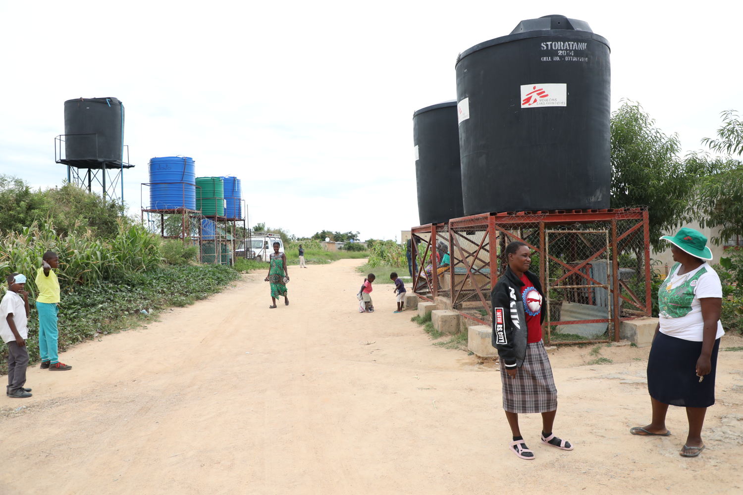 Precious Kapeka collects water from a well in Stoneridge. The community has benefitted from MSF installing boreholes and wastewater management system in Stoneridge to prevent bacterial contamination which used to occur as a result of underground septic tanks. Photographer: Dorothy Meck