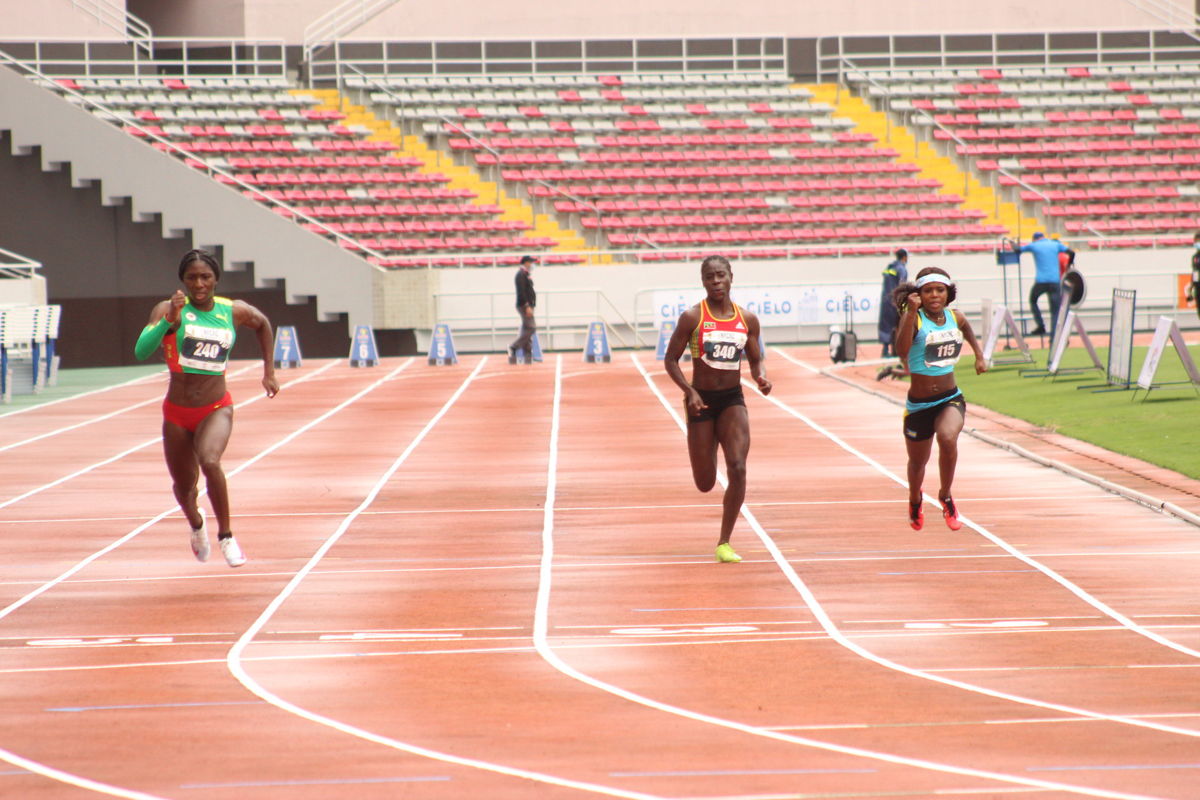 Halle Hazzard of Grenada wins the Women's 100m Dash. Photo by Mike Maassen (FECOA).