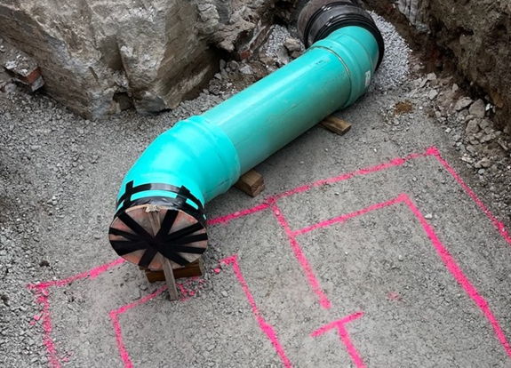 Inside the work zone at Sixth Avenue and Diamond Street where new 15-inch drainage pipe is being installed with a pink outline depicting where the new catch basin will be placed Inside the work zone at Sixth Avenue and Diamond Street where new 15-inch drainage pipe is being installed with a pink outline depicting where the new catch basin will be placed