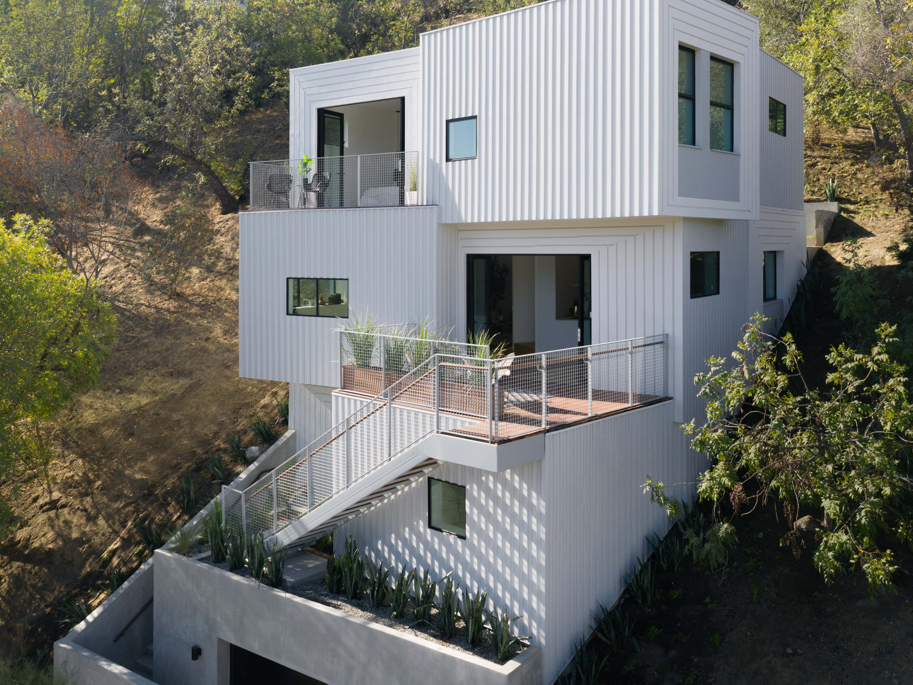 FreelandBuck Designs Stack House, a Four-Story Home Notched into a Los Angeles Hillside