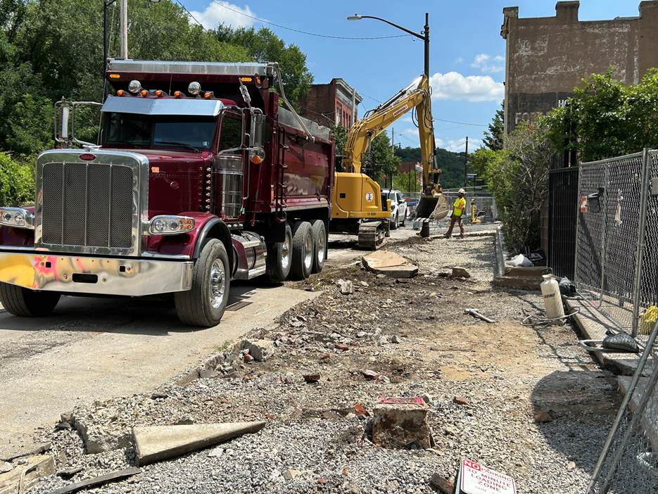 Sidewalk demolition on the south side of Fifth Avenue near Dinwiddie Street