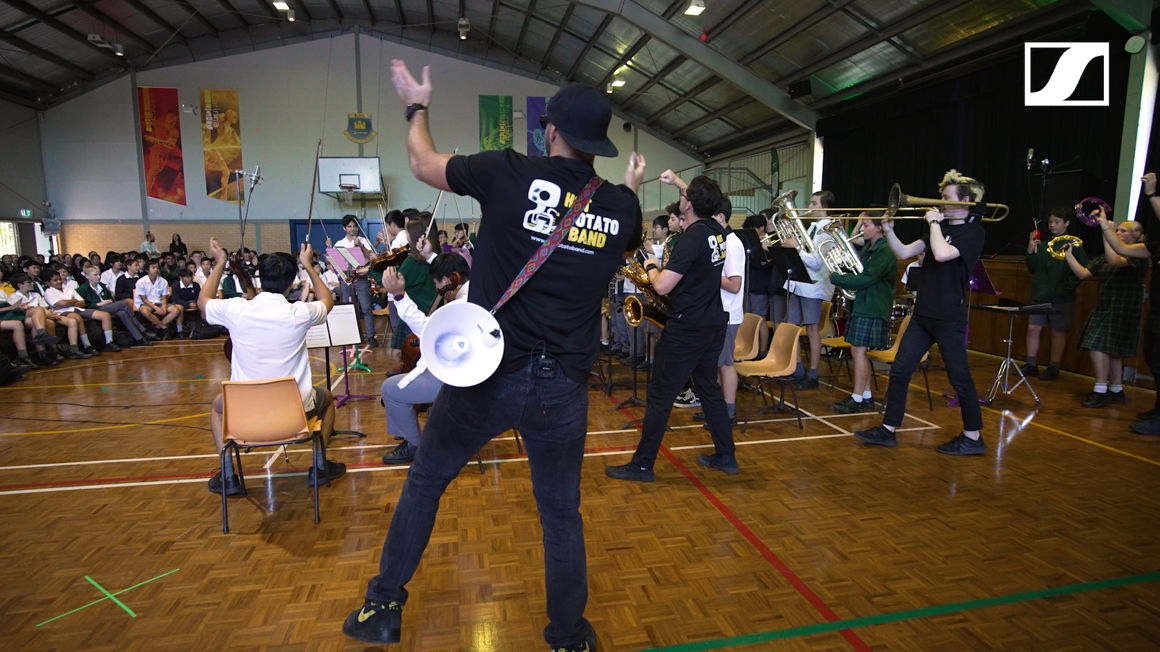 The Hot Potato Band brings a lively energy to the Killara High School students during their Workshops & School Concerts program, cheering and playing music alongside them.
