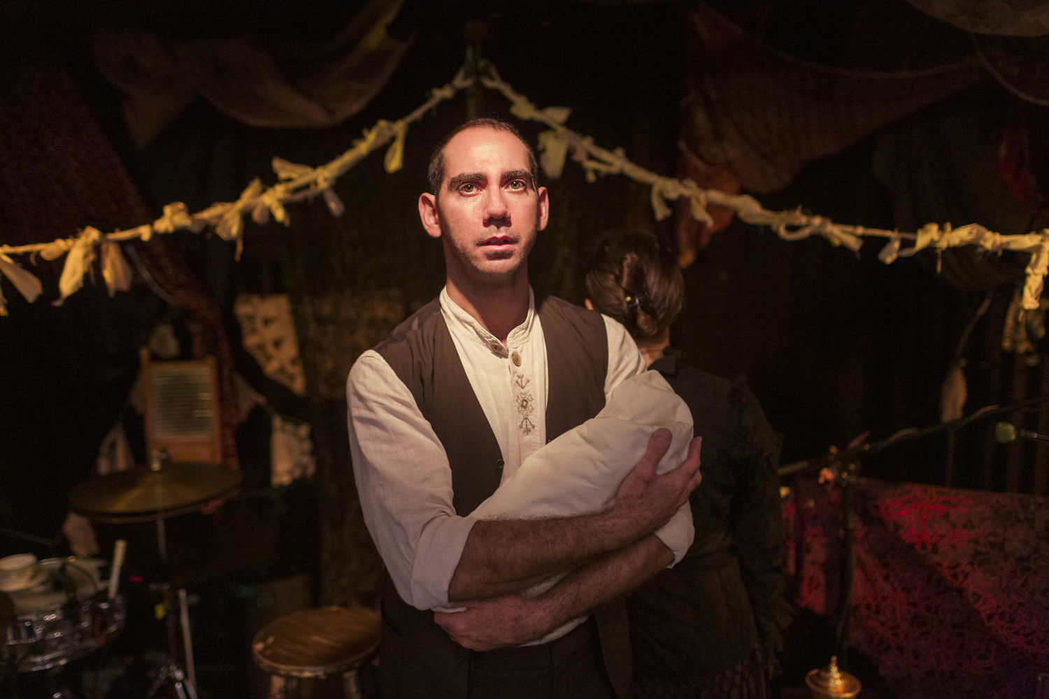 Eric Da Costa (Chaim, woodwinds) in Old Stock: A Refugee Love Story / Photos by Jamie Kronick / Louisa Adamson & Christian Barry – Set & Lighting Design | Carly Beamish - Costume Design
