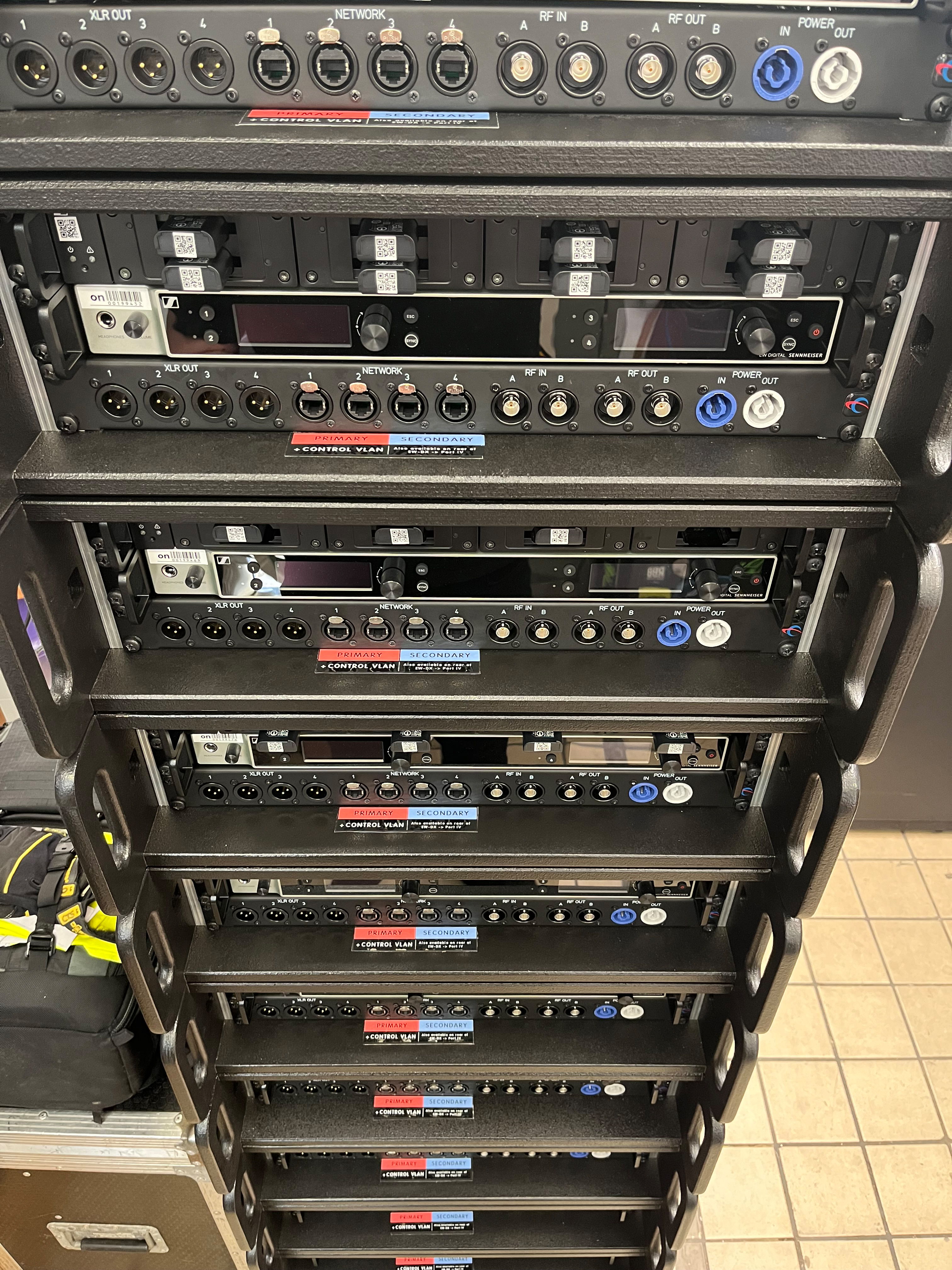 The custom-made racks, each with an EW-DX quad receiver and L 6000 charging station