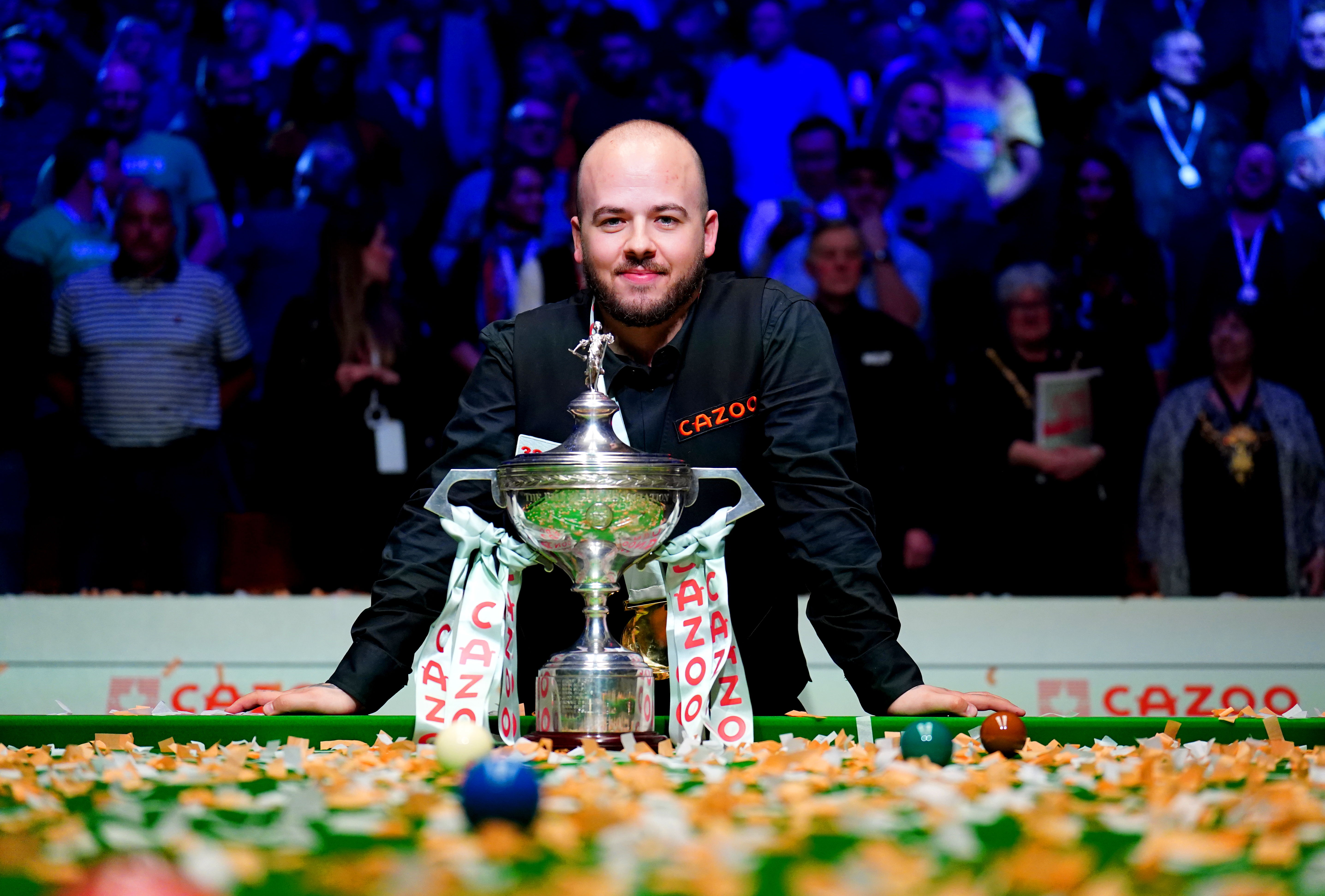 Luca Brecel with his World Snooker Championship trophy. © PRESSASSOCIATION