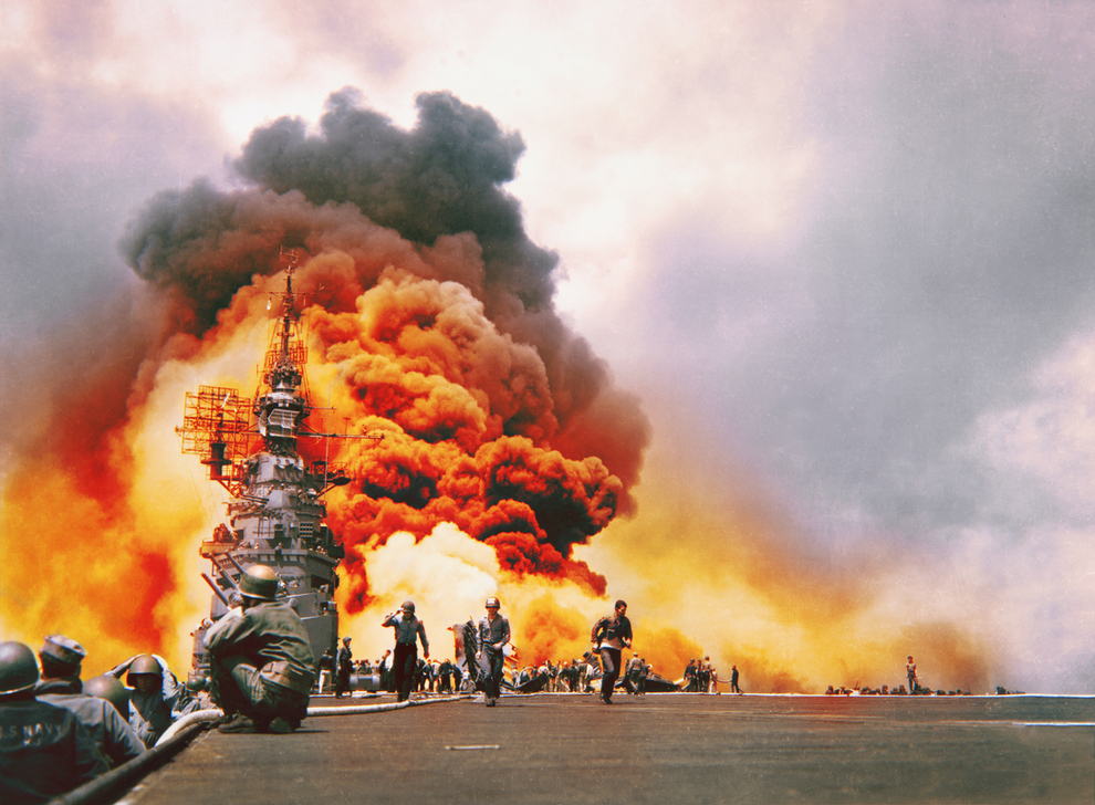 Scene on the flight deck of the aircraft carrier USS Bunker Hill, as its crew fights fires caused by Kamikaze suicide attacks, off the coast of Okinawa. AKG8740111 © akg-images