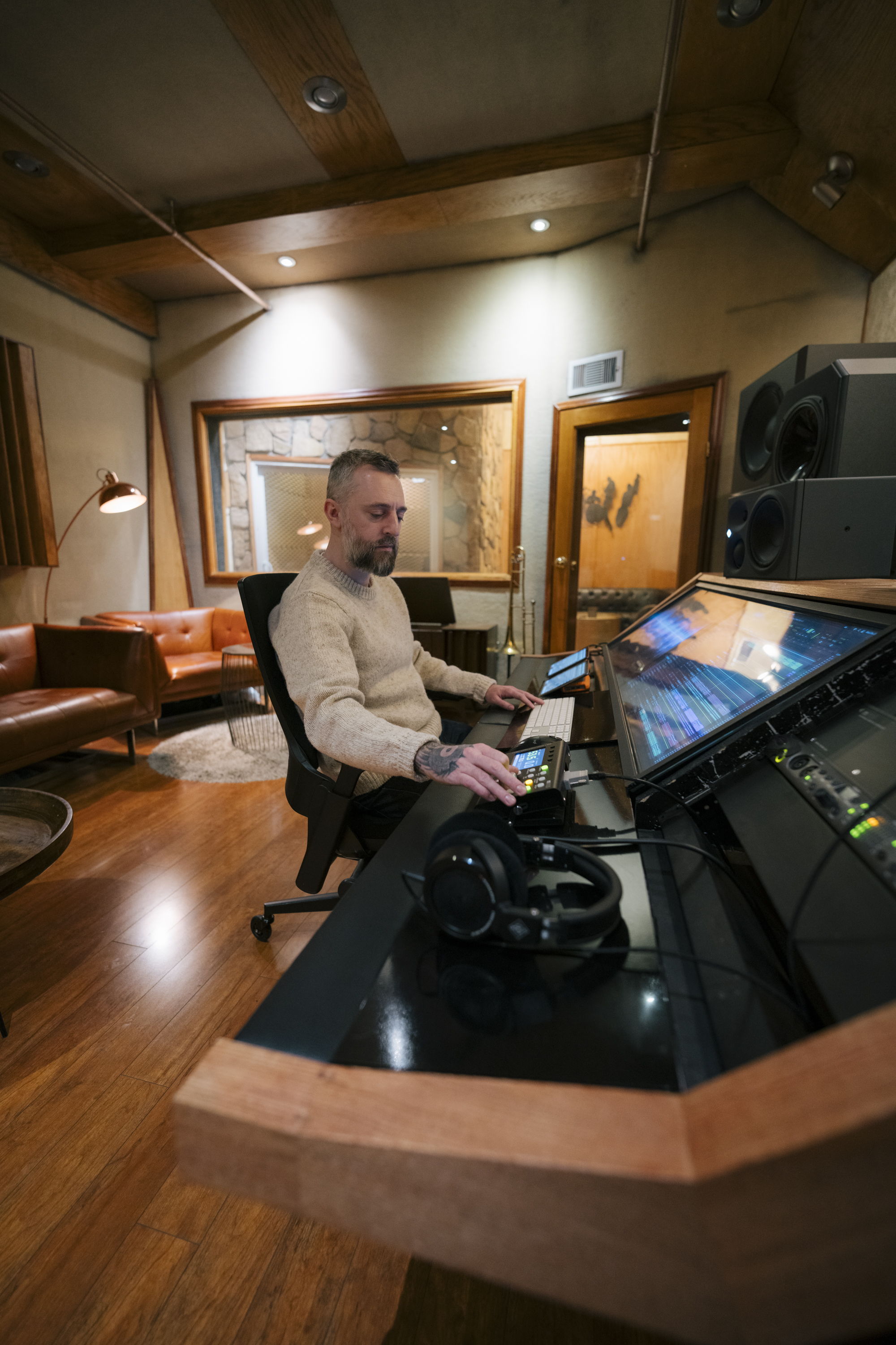 Mikaelin ‘Blue’ BlueSpruce mixes on his Neumann KH 310 monitors in Brown Sugar studio, with his trusted NDH 30 headphones at his side.