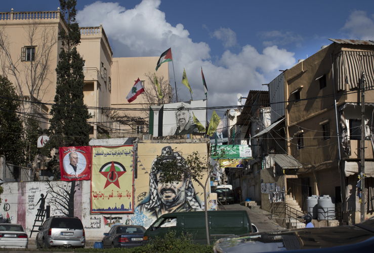 Street scene depicting two portraits of the former Palestinian leader Yasser Arafat. Beirut, Lebanon, 2019, (c) Photo: Mashid Mohadjerin ×