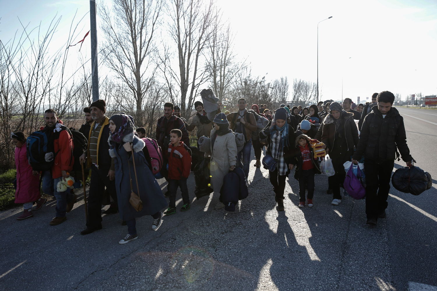 Konstantinos Tsakalidis/SOOC.  Refugees and migrants walk from the gas station of Polykastro towards the transit camp in Idomeni. The authorities did not allow the departure of the buses until crowding at the transit camp in Idomeni had eased.