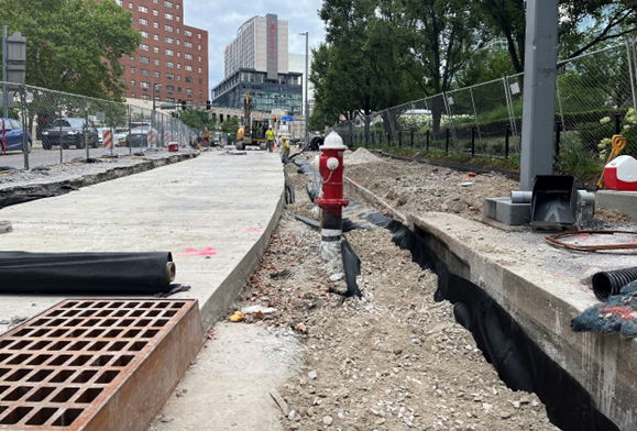 Inside the work zone at Sixth Avenue and Grant Street where contractors relocated a fire hydrant and catch basin to accommodate the expanded sidewalk