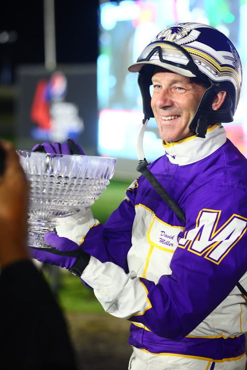 Dave Miller with the Mohawk Million trophy (New Image Media)