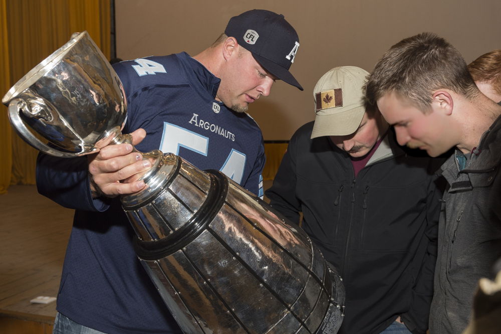 Chris Van Zeyl military members deployed on OP UNIFIER with the Grey Cup in Starychi, Ukraine. Photo: MCpl Mathieu Gaudreault, Canadian Forces Combat Camera