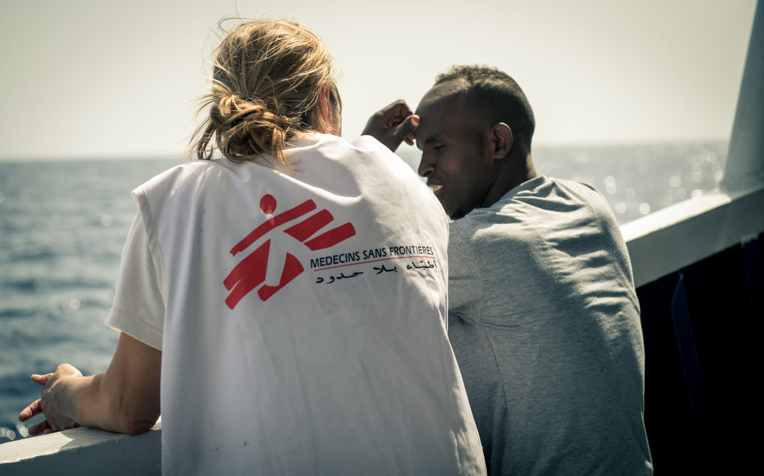 Credit: Gabriele François Casini / MSF Caption: Doctor Erna Rijnierse has a chat with an Eritrean man assisted on May 7th 2015. MY Phoenix search rescue and medical aid vessel jointly operated by MSF and MOAS successfully completed their second rescue of 2015. During the rescue 219 people were brought on board the MY Phoenix including 55 women (3 pregnant) and 33 children including 9 children under 5 and 2 babies of 3 month old and 1 year and four month. The majority of which were from Somalia and Syria. In the hours following the rescue the MSF triaged all patients and had consultations with those with medical issues.