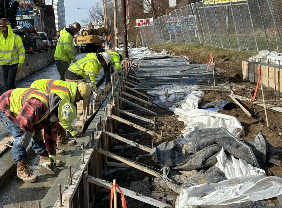 Curb installation along Fifth Avenue between Gist and Jumonville streets Curb installation along Fifth Avenue between Gist and Jumonville streets