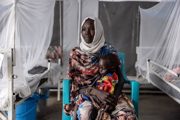 mother and child inside the therapeutic feeding center for malnourished children at the MSF Hospital in Metche, in eastern Chad, August 7, 2024. Metche camp hosts about 40,000 Sudanese refugees who have fled violence in Darfur. | Date taken: 08/08/2024 | Photographer: Finbarr O’Reilly | Location: Chad