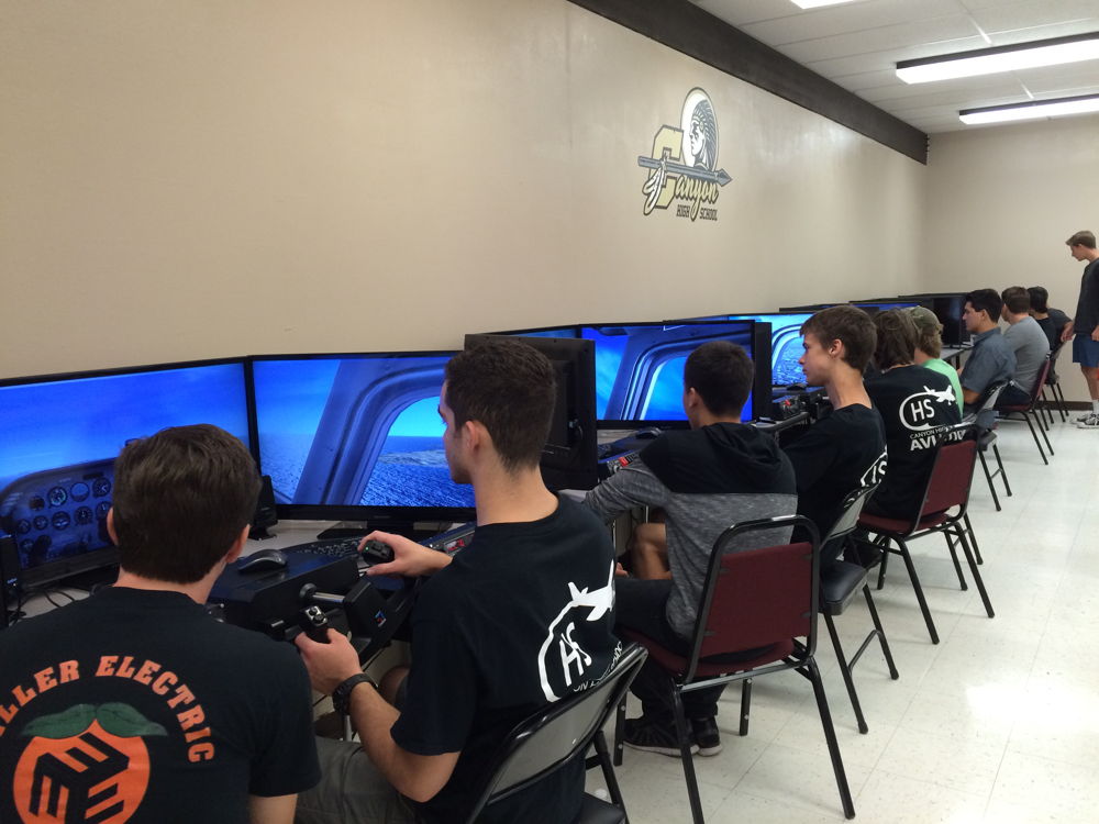 Students at Canyon High School practice actual flight training maneuvers in advanced simulators.