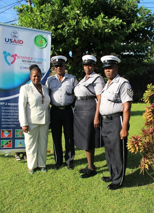 Ms. Gloria Septra Augustus with officers.
