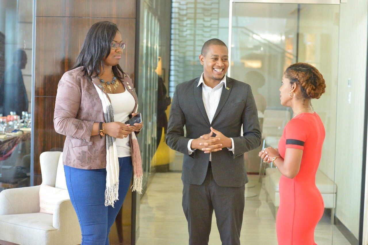 Co-Chairs of the Learning for Youth Networking and Change Sessions (LYNCS), Asha-Gaye Cowell (l) and Kurba-Marie Questelles (r), engage Jamaica’s Youth Minister, Hon. Floyd Green in discussion at the Caribbean Youth Summit on Violence Prevention 2019, held on January 15 and 16 in Georgetown, Guyana.