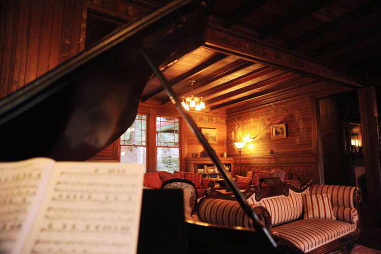 A glimpse of the library with the 1914 Steinway.
Photo credit: Kelly Merchant Photography.