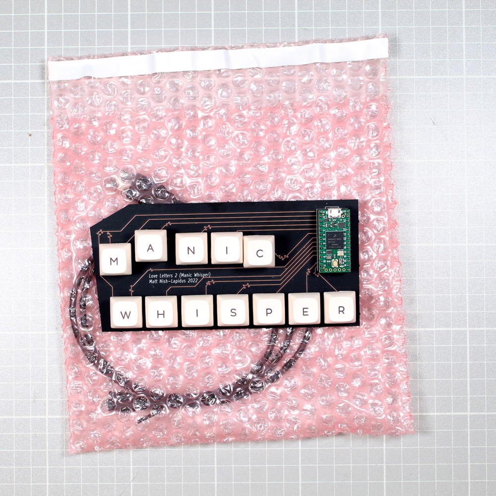 Matt Nish-Lapidus, Love Letters 2 (Manic Whisper), 2022. Custom printed circuit board, artist software, keyboard keys, surplus key caps, USB cable, 15 x 7.5 cm. Edition of 2 (+1 AP). Courtesy the artist. Photo: Blair Swann.