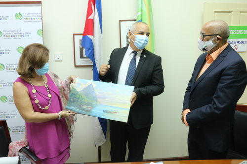 H. E. Alejandro Simancas Marin and Lourdes Aguilera Leon receive gift from Dr. Didacus Jules on behalf of the OECS Commission