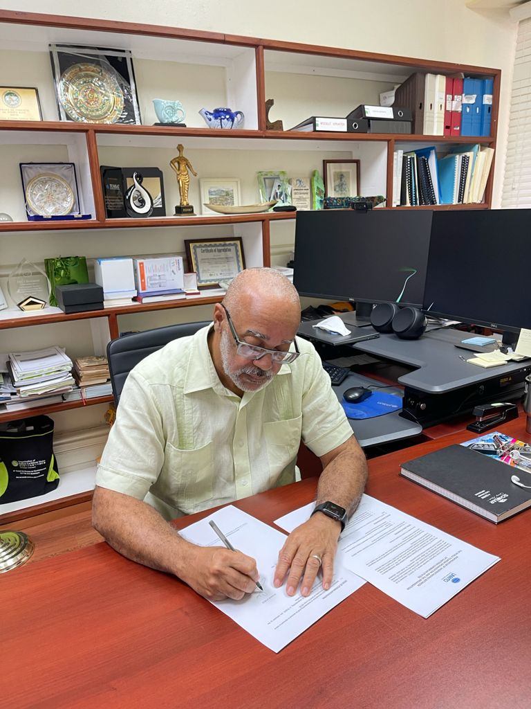 Director General of the OECS, Dr. Didacus Jules signs the MOU with the World Tourism Organization.