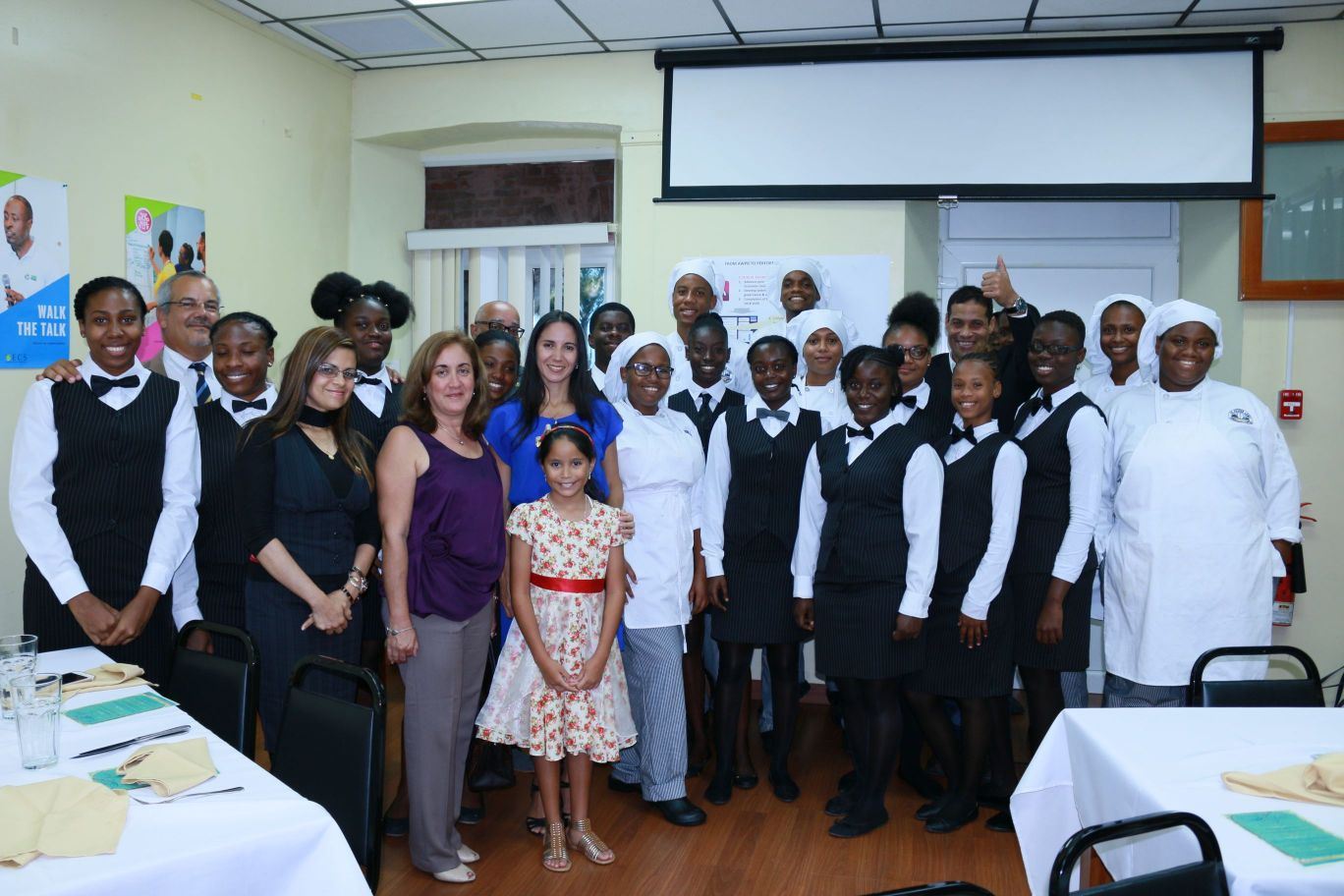 H.E. Escalona (centre) thanks Sir Arthur Lewis Students and staff of the OECS Commission