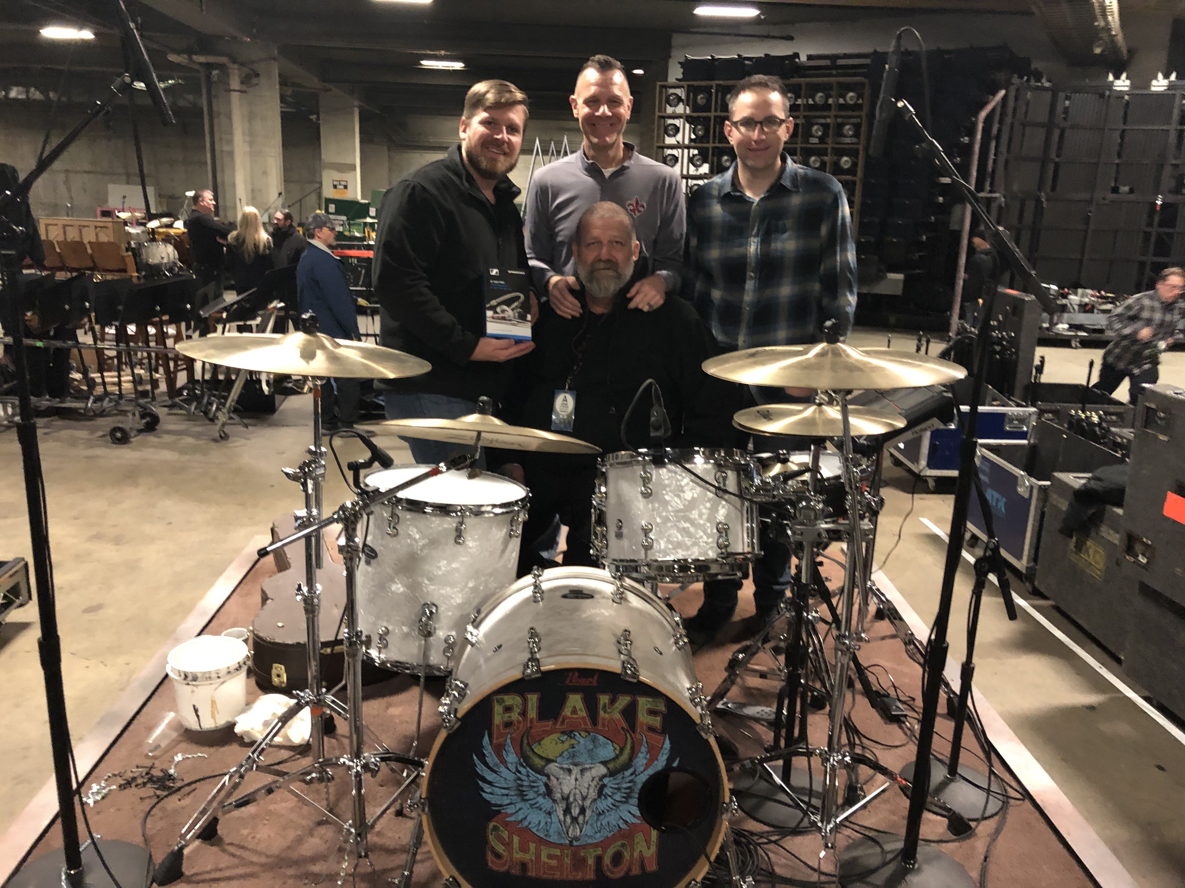 Blake Shelton team, (L-R)
: Ed Hardin, Drum Tech; Tracy Broussard, Drums; Brad Baisley, Monitor Engineer; and Jeff Parsons, FOH (Bottom) – (Photo by Tim Moore)
​