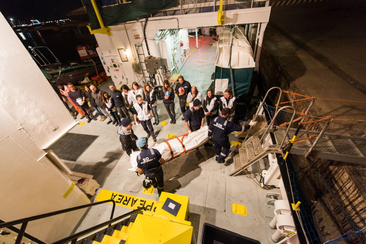 The bodies of two mothers who drowned in the Mediterranean are taken off Aquarius to be laid to rest, January 2018. Copyright: Laurin Schmid/SOS MEDITERRANEE