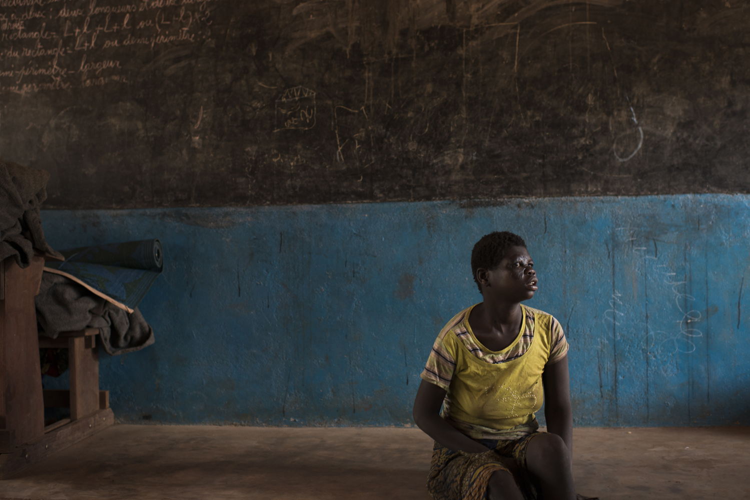Credit Colin Delfosse. Catherine, 16, fled her village with her parents and her fourteen brothers and sisters after it was burned. They found shelter in the village of Ngoubi's school, 18km from Bria.