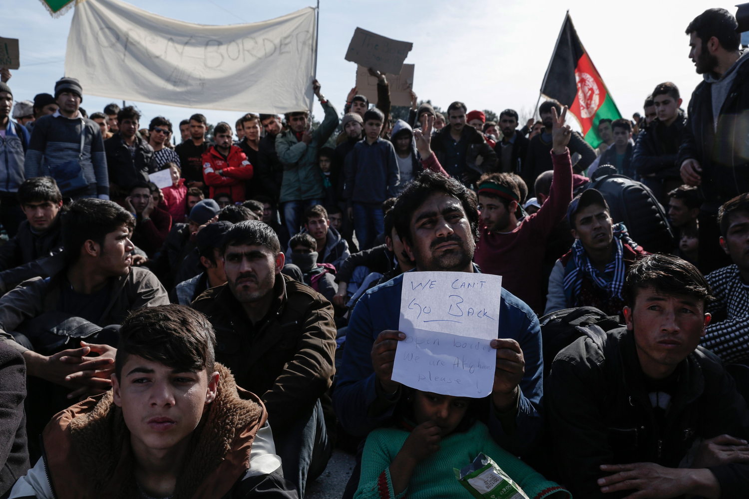 Konstantinos Tsakalidis/SOOC. Afghans protest next to the Greek-Macedonian (FYROM) border near the northern Greek village of Idomeni. The FYROM authorities have closed the border to Afghan refugees.