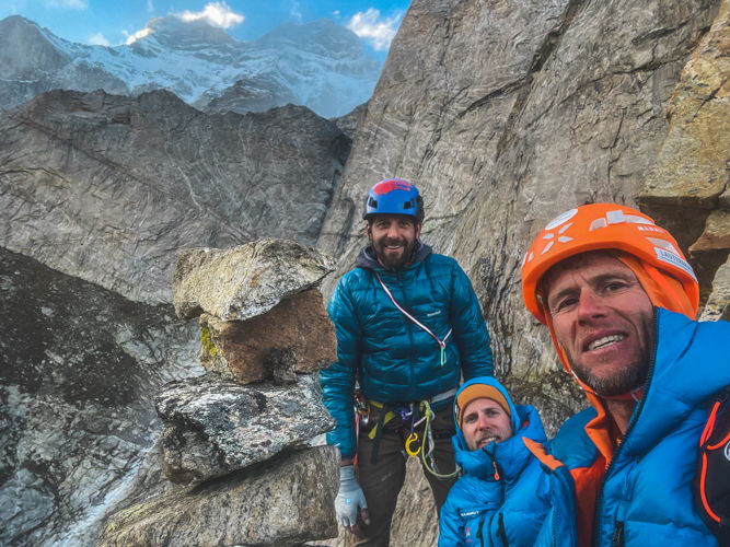 The three happy alpinists at the bottom of the pillar with the Shivling in the background. Photo: Stephan Siegrist