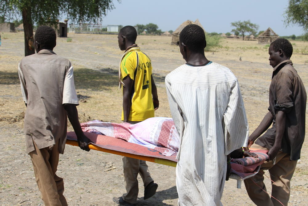 One woman, who has had a possible stroke is brought by stretcher. A decision is made by the medical team that she needs to be brought to MSF’s Malakal hospital as her situation is critical. The MSF doctor decides that she can’t travel by road as the ride is too rough. Instead a boat is rented from the local fishermen and the next day they travel.

The woman’s family explains that they would have tried to carry the woman to hospital on their back to the hospital at Aburoc had the team not arrived. Photographer: Philippe Carr/MSF