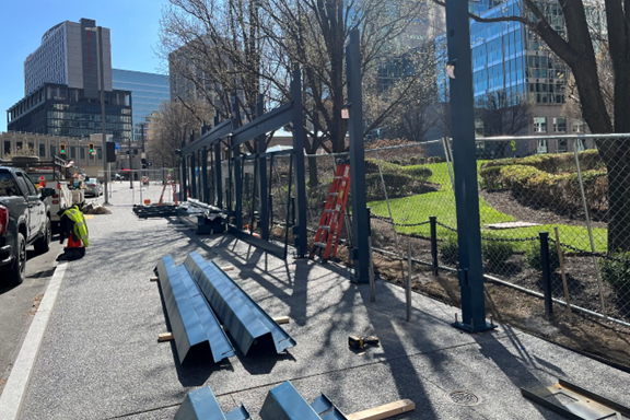 Metal frames being erected for bus shelters at Steel Plaza Station