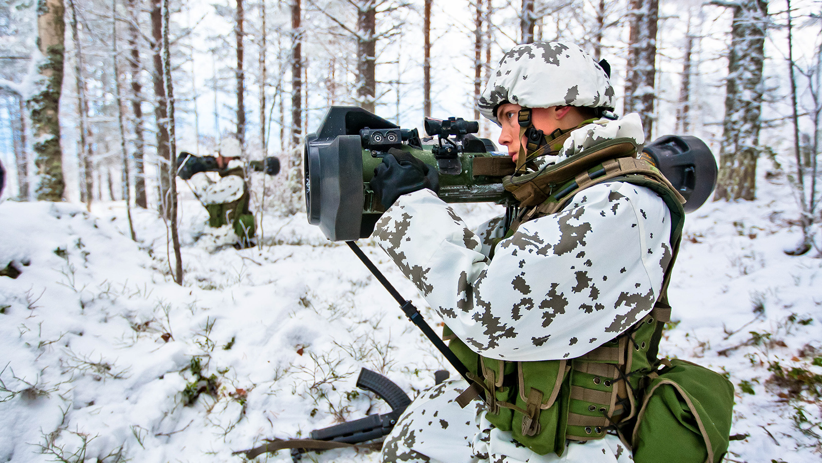 The Finnish Army on manoeuvres with the NLAW light anti-tank weapon - primarily intended for use against heavy armoured vehicles, but it is also suitable for destroying infantry fighting vehicles and light armoured vehicles as well as weapon positions.  The NLAW is a disposable, fire-and-forget anti-tank weapon intended for use by individual soldiers.   The missile uses predicted line of sight, PLOS, for homing on targets. The missile may engage a target by direct attack, DA, or overflight top attack, OTA.