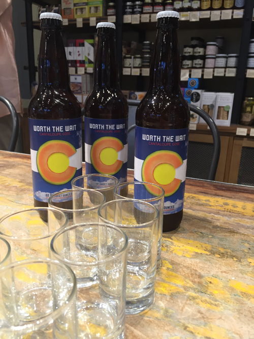 Finished bottles of Worth the Wait Cantaloupe Gose ready for the pairing class at Cheese+Provisions, Denver.