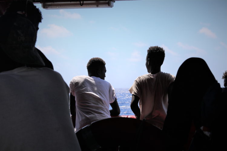 Rescued people on board Ocean Viking waiting on deck.
Copyright: Hannah Wallace Bowman/MSF
