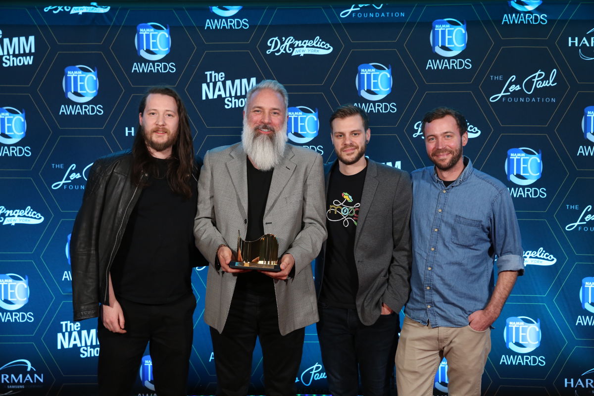 Nick Valente, Joe Richardson, Andrew Stryffeler, and Logan Kelly accept the TEC Award on behalf of the 100+ Employee Owners of Moog Music.
