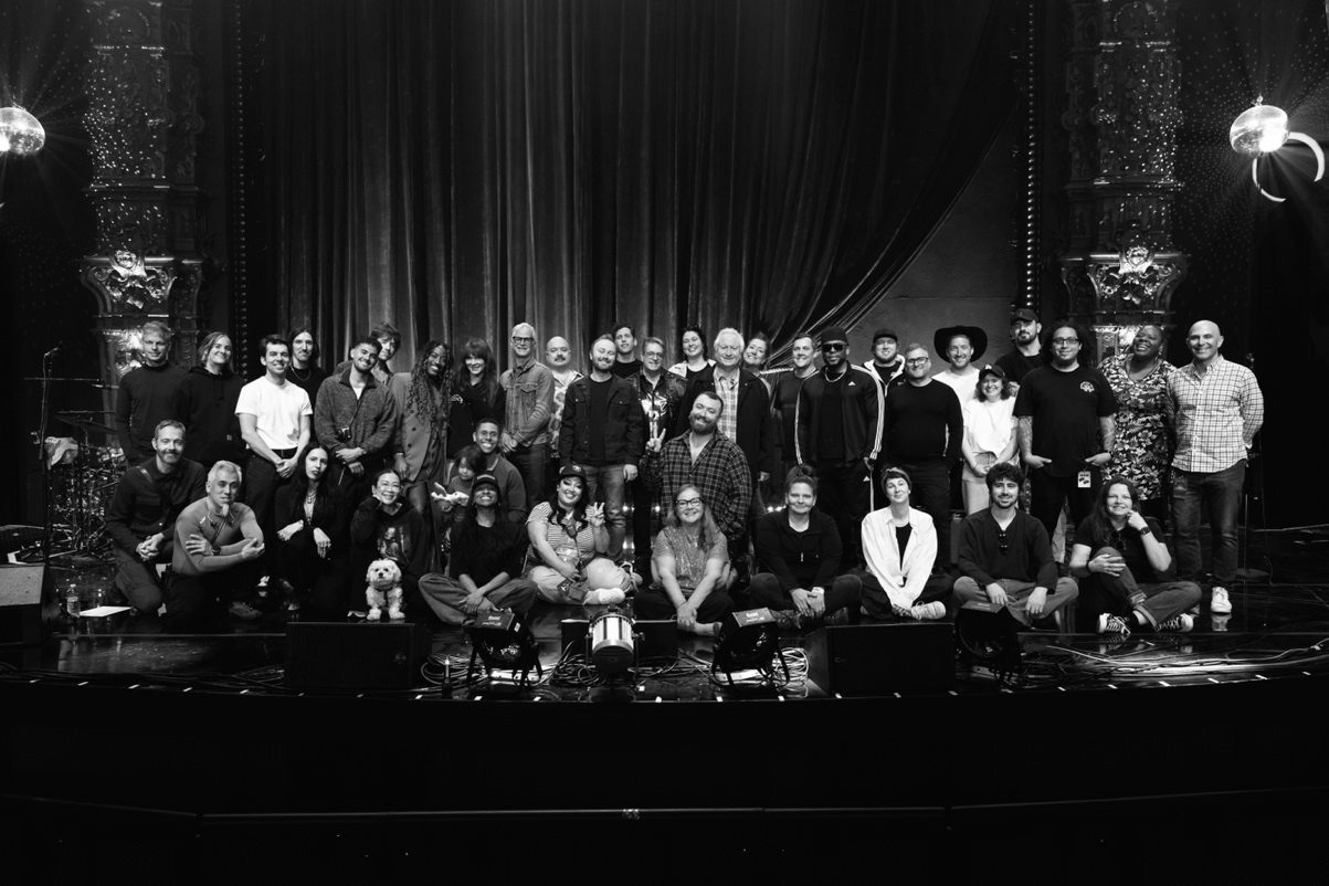 Sam, band and production team behind the scenes of their recent residencies.