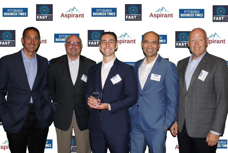 Representatives from The Efficiency Network (TEN) celebrate after placing No. 10 overall in the Pittsburgh Business Times "Fast 50" awards at the Westin hotel in Pittsburgh. ​ Pictured from left: CEO Troy Geanopulos, Construction Director Joe Statler, Project Manager Brint Goettel, CFO Khalil Qasimi and COO Rob Campbell