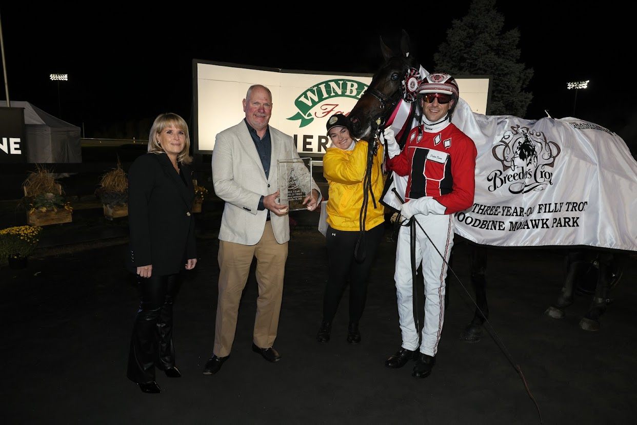 Jiggy Jog and connections celebrating after winning the 3 Year Old Filly Trot Breeders Crown Final (New Image Media)