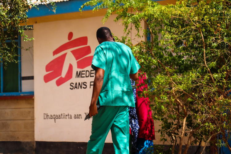 A nurse walks a patient into the consultation room in MSF's hospital in Dagahaley