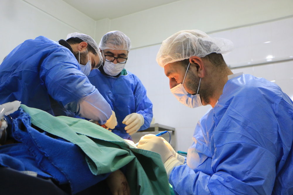 Syrian doctors operate on a patient in a hospital in Atmeh. The equipment for the operating room of this hospital comes from a donation from the MSF team in Atmeh. February 11, 2023. Photographer: Abdul Majeed Al Qareh