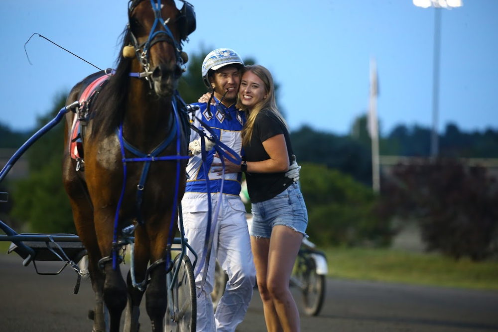 Hasty Bid, James MacDonald and Paige Austin embrace after their first win on July 19, 2022 (New Image Media) 