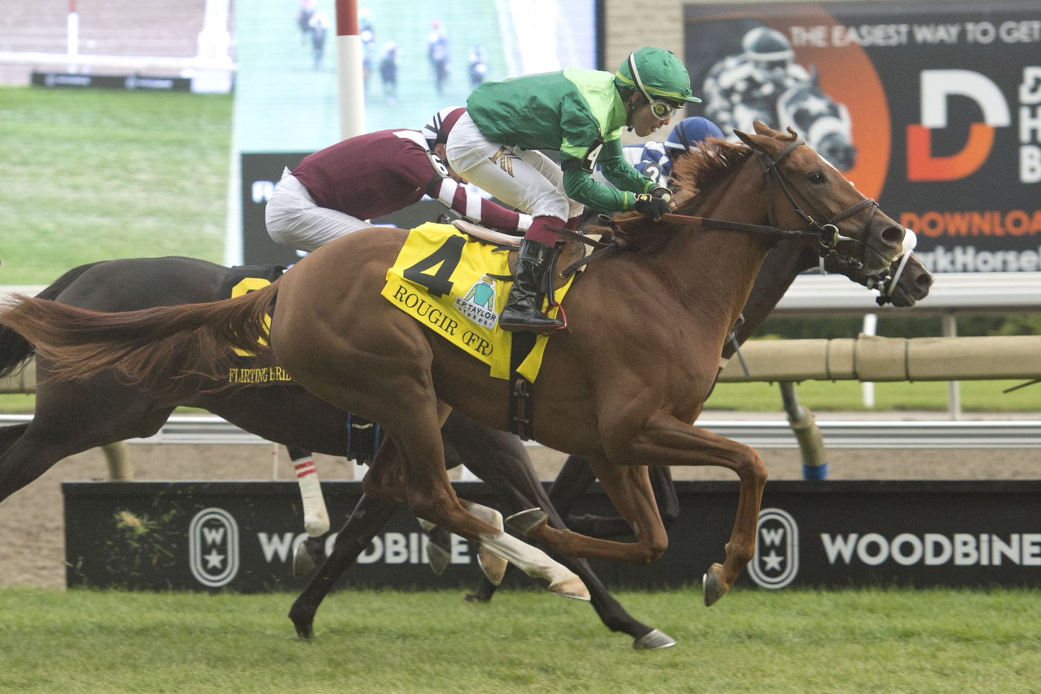 Rougir and jockey Kazushi Kimura winning the 2022 E.P. Taylor Stakes on Woodbine's E.P. Taylor Turf Course (Michael Burns Photo)