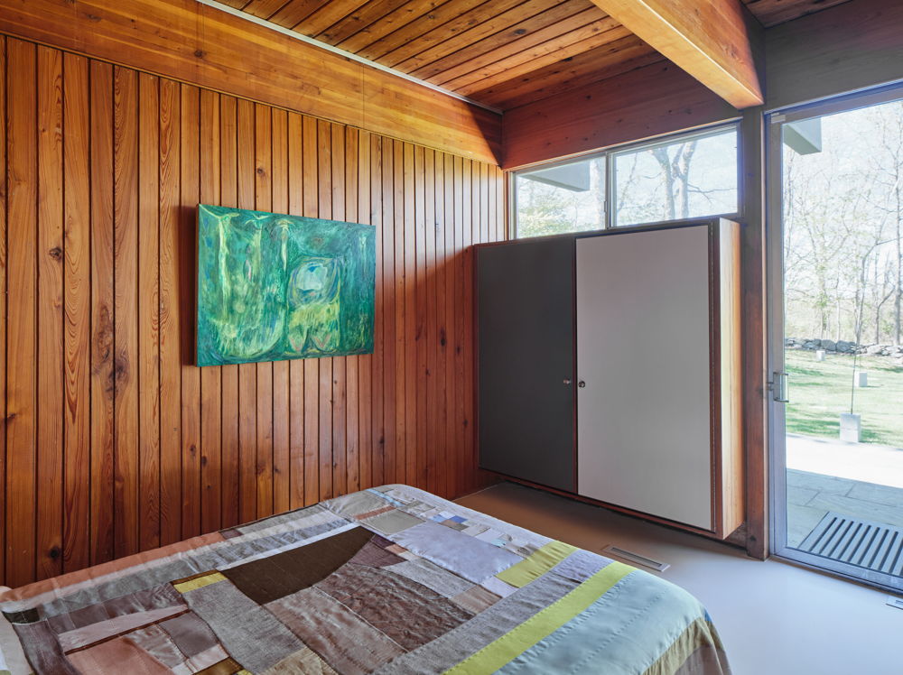 At The Luss House: Blum & Poe, Mendes Wood DM and Object & Thing. The Gerald Luss House, Ossining, New York. Photo by Michael Biondo. Works pictured [wall]: Mimi Lauter, Untitled (2021); [bed] Kiva Motnyk, Pastoral Landscape  - Soft Neutrals (2021).