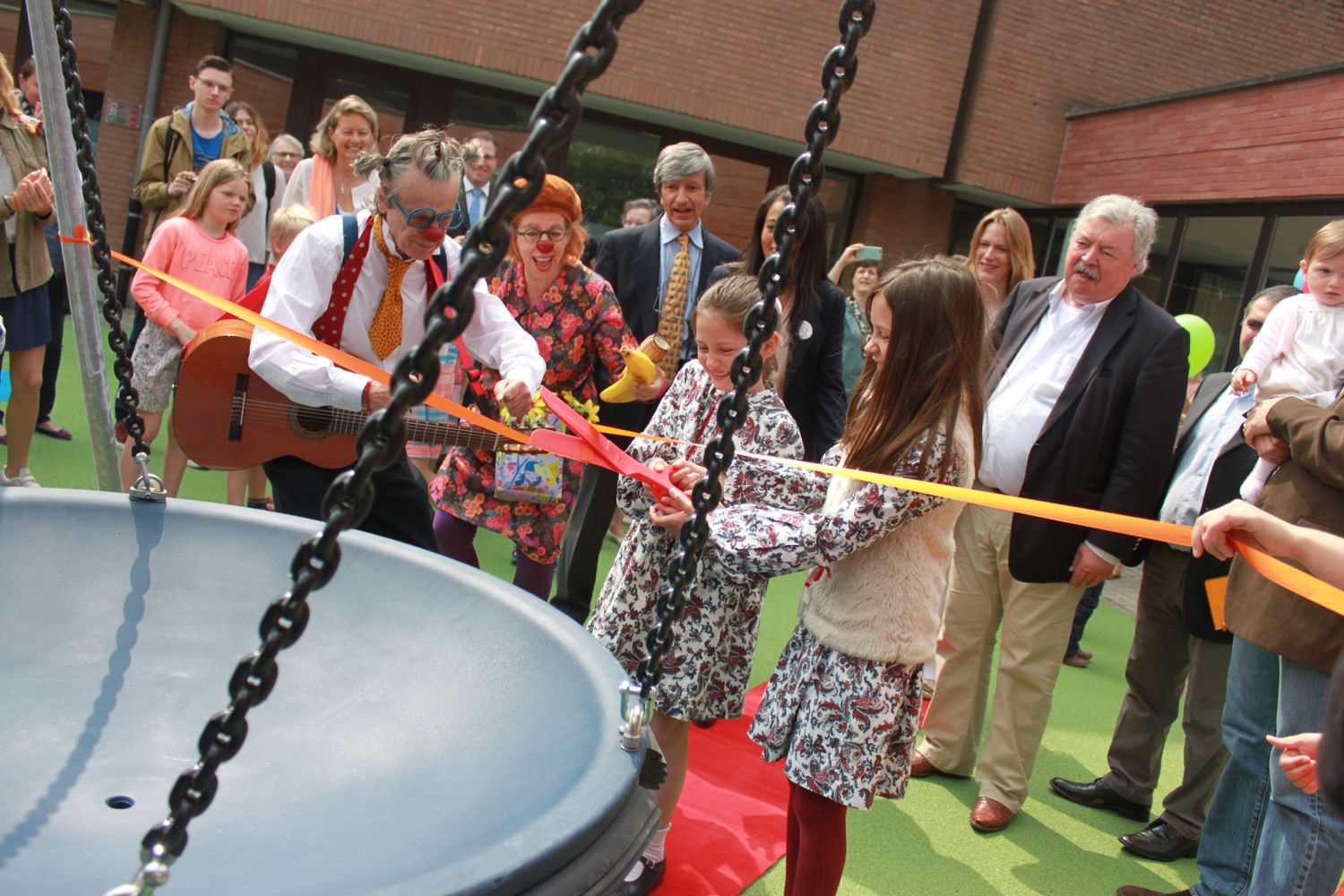 Lydia's sisters, opening the playground in memory of their sister who spent many months in intensive care at HUDERF. After Lydia's death, creating this playground became a way to honour Lydia's life and to ensure that her smiles and joie de vivre lived on in the smiles and laughter of other small patients and their siblings.    